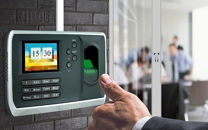 Biometric attendance machine at an office entrance